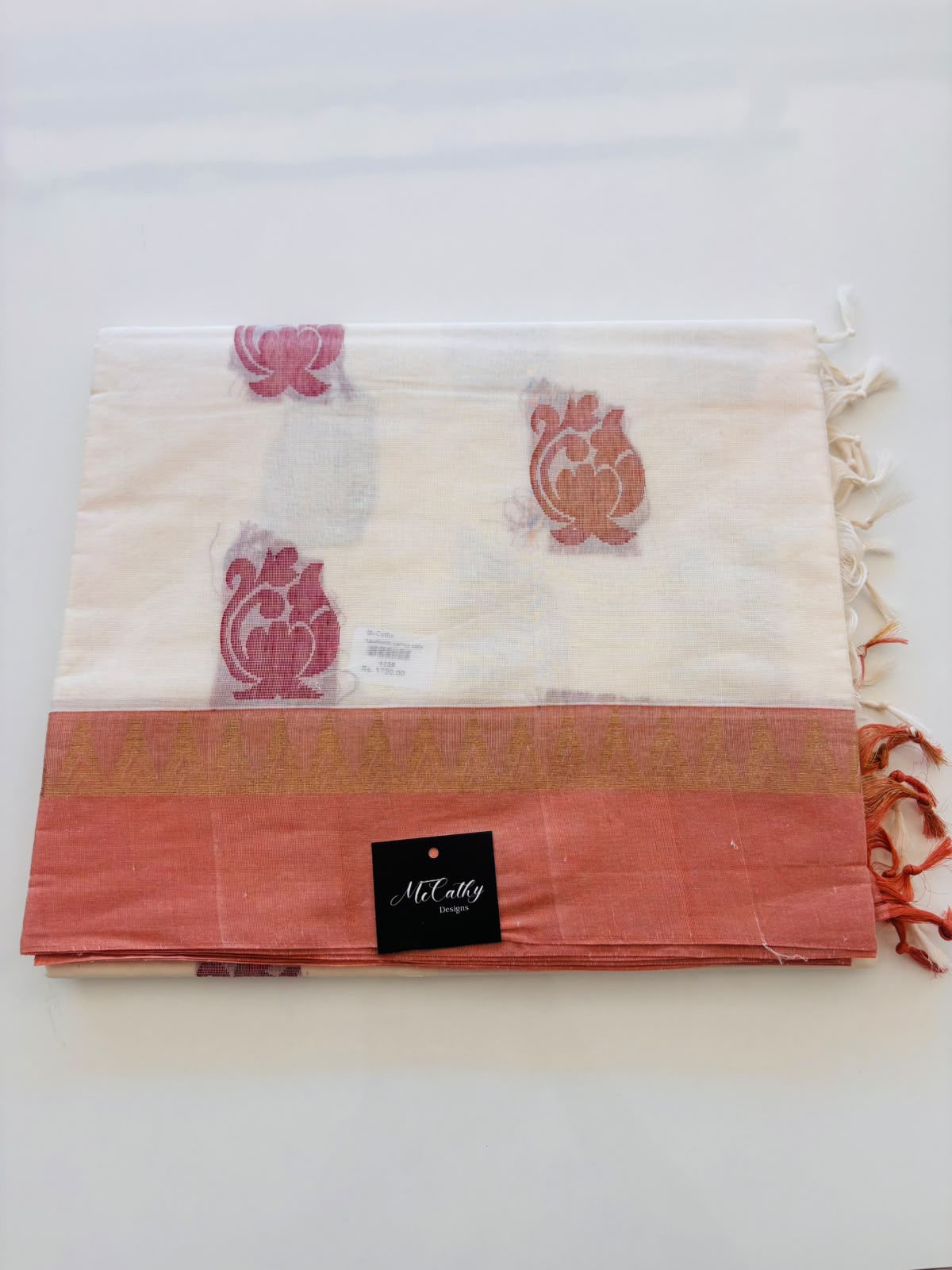 Off White Cotton Saree with Floral Motifs & Peach Border
